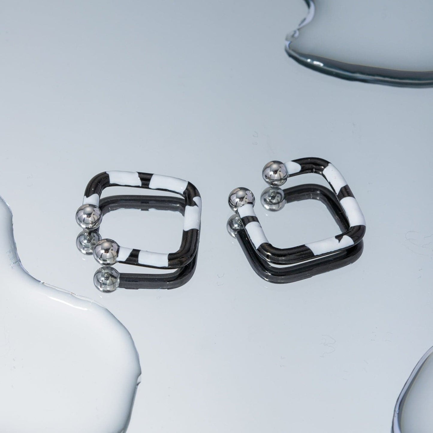 Stainless Steel Oil Drip Cuff Earrings.