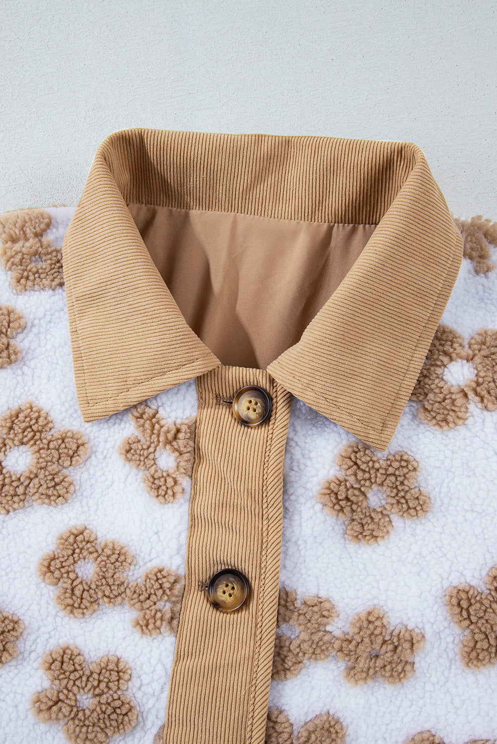 Charming beige fleece jacket with cute flower patterns and button-up design