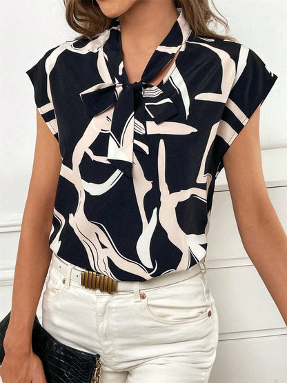 Printed Tie Neck Cap Sleeve Blouse.