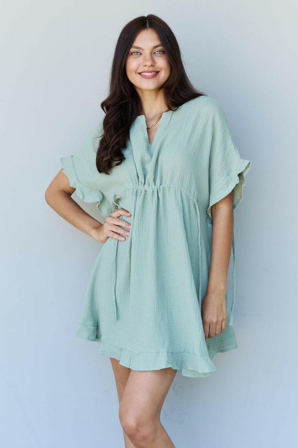 Ninexis Out Of Time Full Size Ruffle Hem Dress with Drawstring WaistbaExperience Effortless Elegance with the Ninexis Out Of Time Full Size Ruffle Hem Dress in Light Sage. This stunning dress is crafted from 100% cotton, providing a soLove Salve Time Full Size Ruffle Hem DressTIKTOK