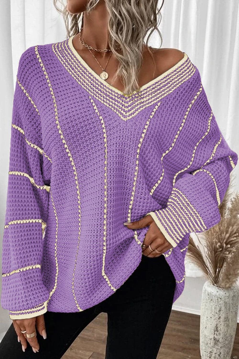 Vibrant striped v-neck sweater with dropped shoulders