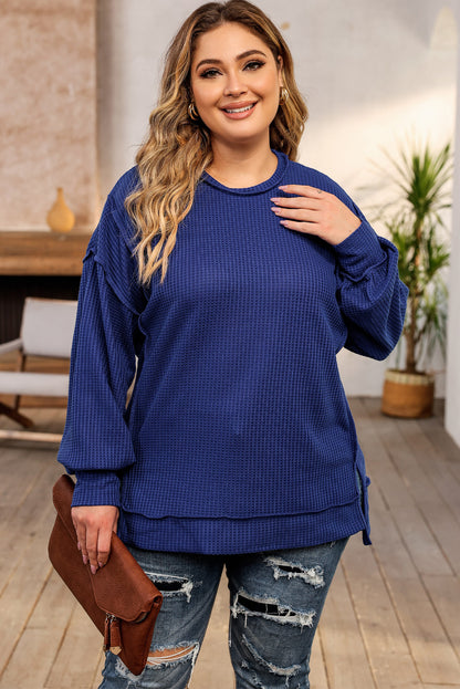 Cozy blue oversized waffle knit top with exposed seams