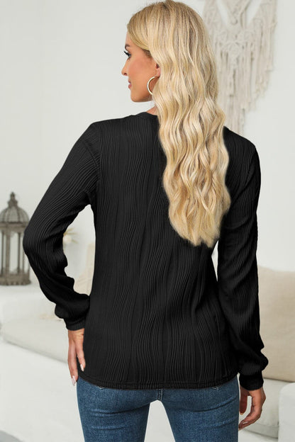 Textured Round Neck Long Sleeve Blouse.