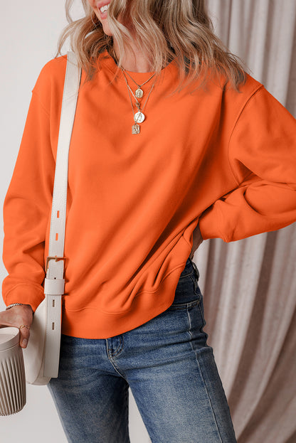 Cozy russet orange fleece-lined sweatshirt with drop shoulders