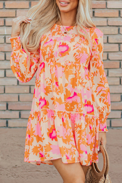 Eye-catching orange abstract smocked mini dress with ruffled lantern sleeves