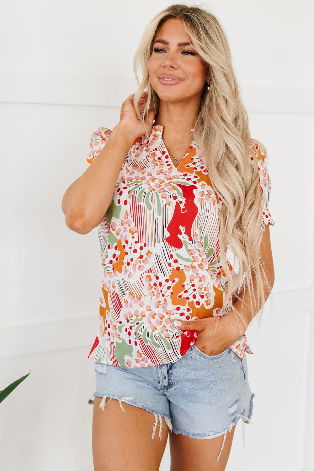 Printed Notched Short Sleeve Blouse.