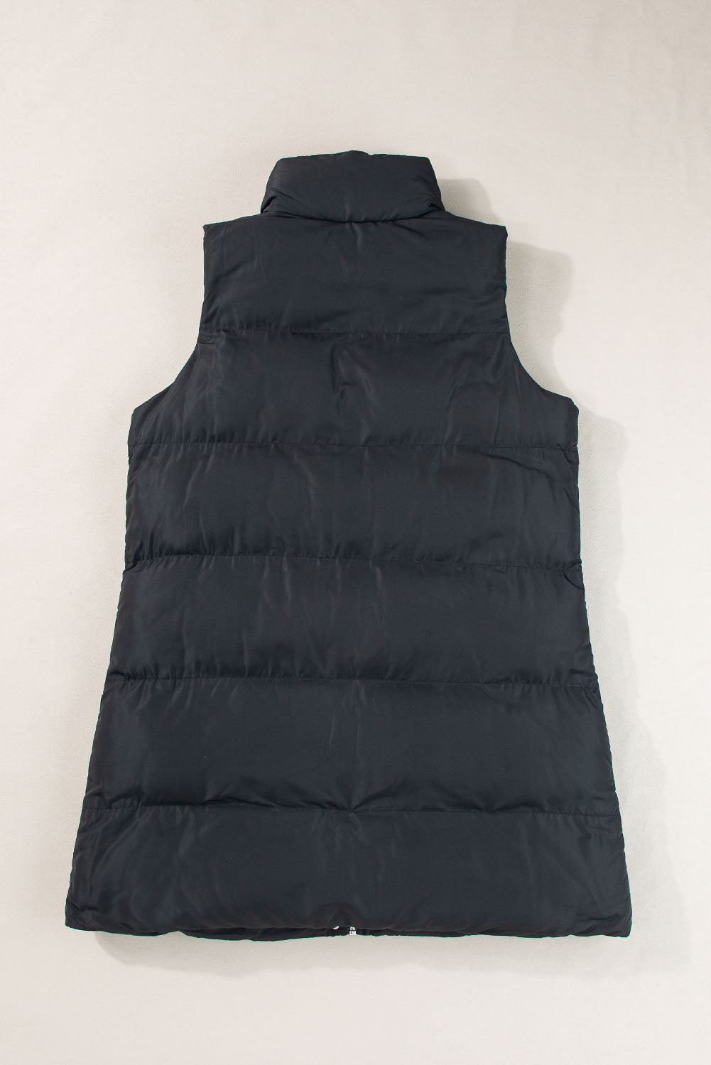 Stylish black longline windproof puffer vest with convenient pockets