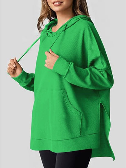 Sleek pocketed hoodie with drawstring and side slit