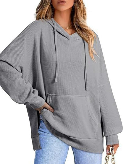 Sleek pocketed hoodie with drawstring and side slit