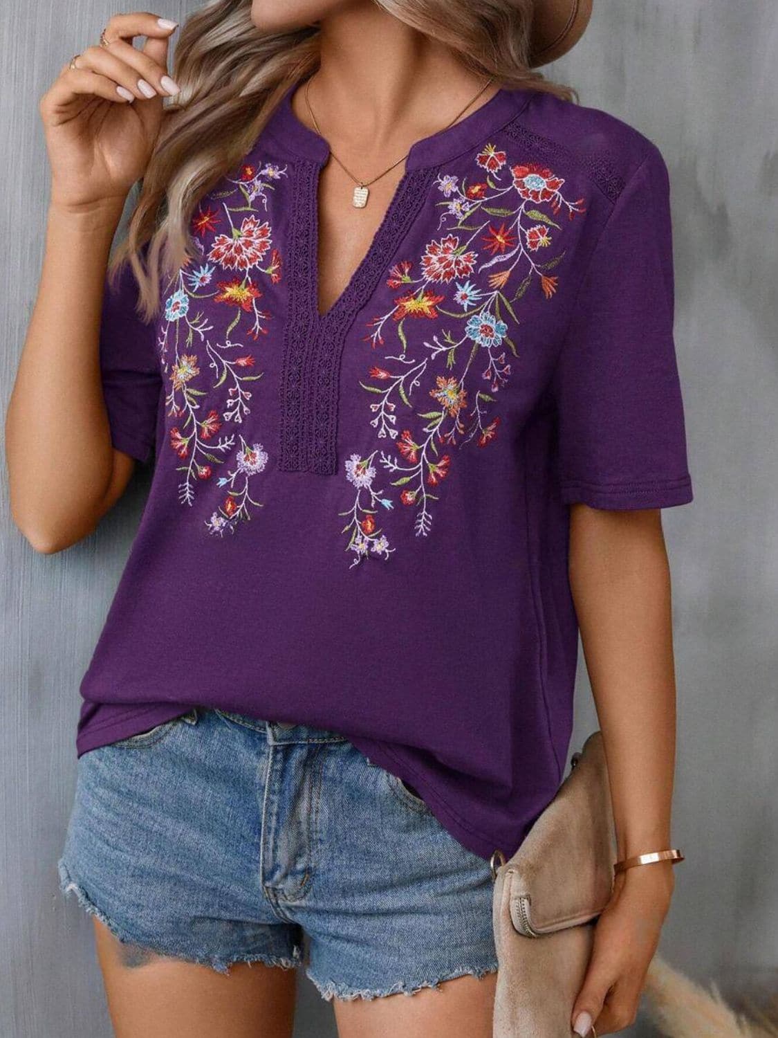 Embroidered Notched Short Sleeve T-Shirt.