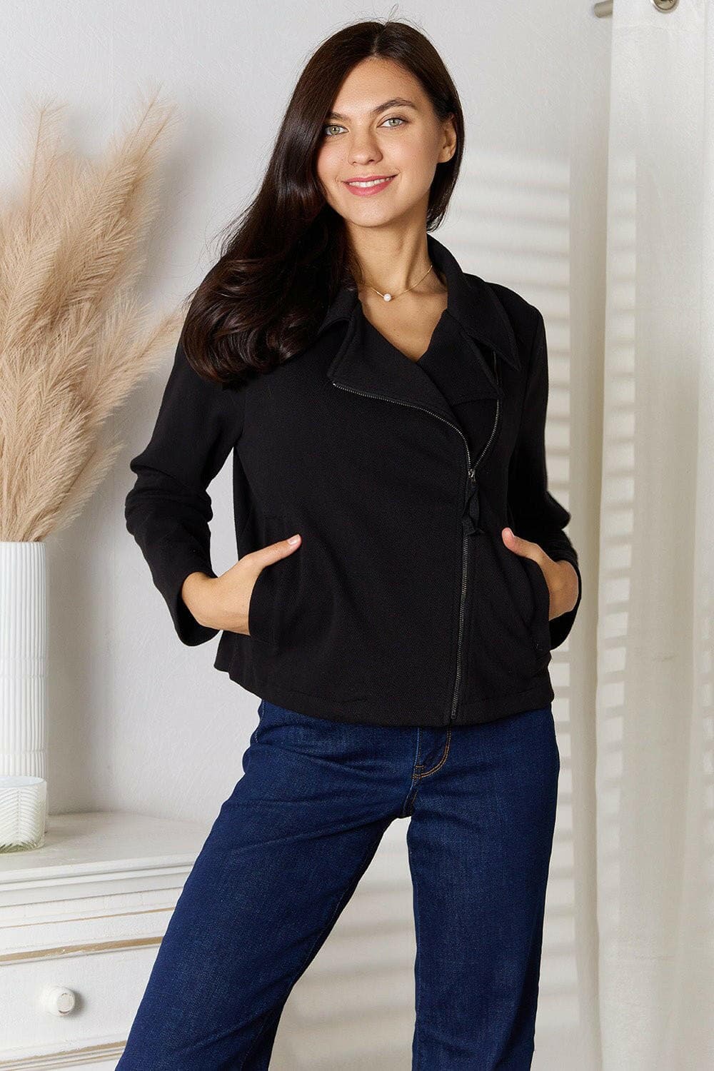 Chic zip-up jacket with pockets, modern wardrobe essential, stylish and functional.