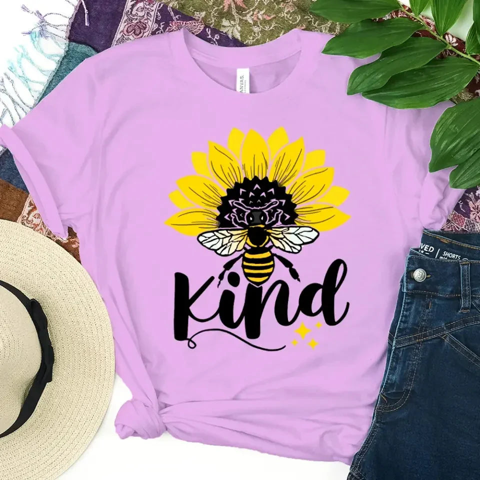 Adorb.co Bee Kind Sunflower Graphic Tee, a close-up of the vibrant 'Bee Kind' graphic on the soft, breathable fabric.