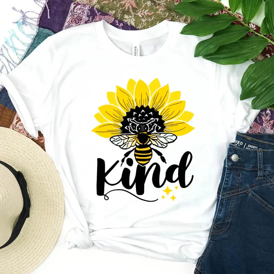 Flat lay of the Adorb.co Bee Kind Sunflower graphic tee styled for a casual, positive message outfit.