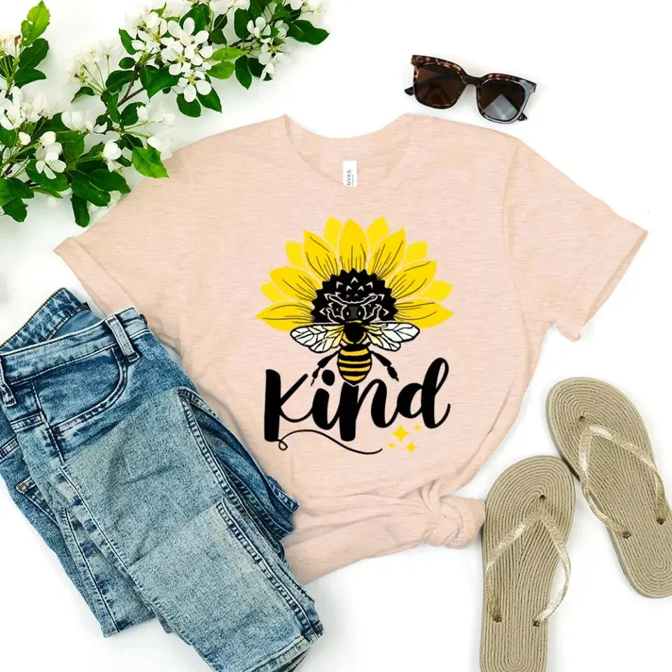 Adorb.co Bee Kind Sunflower Graphic Tee, a model wearing the soft unisex kindness shirt in a casual setting.