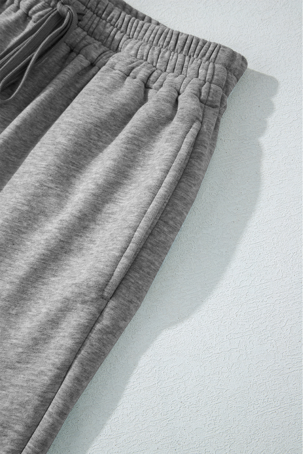 Light grey fleece pants with drawstring