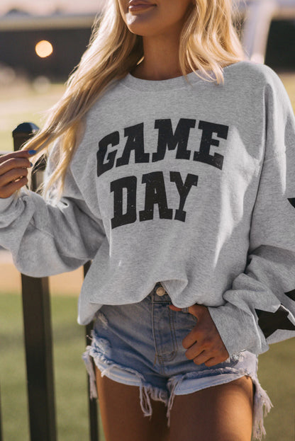 Black Game Day Graphic Rugby Football Season Sweatshirt with relaxed fit and ribbed cuffs.