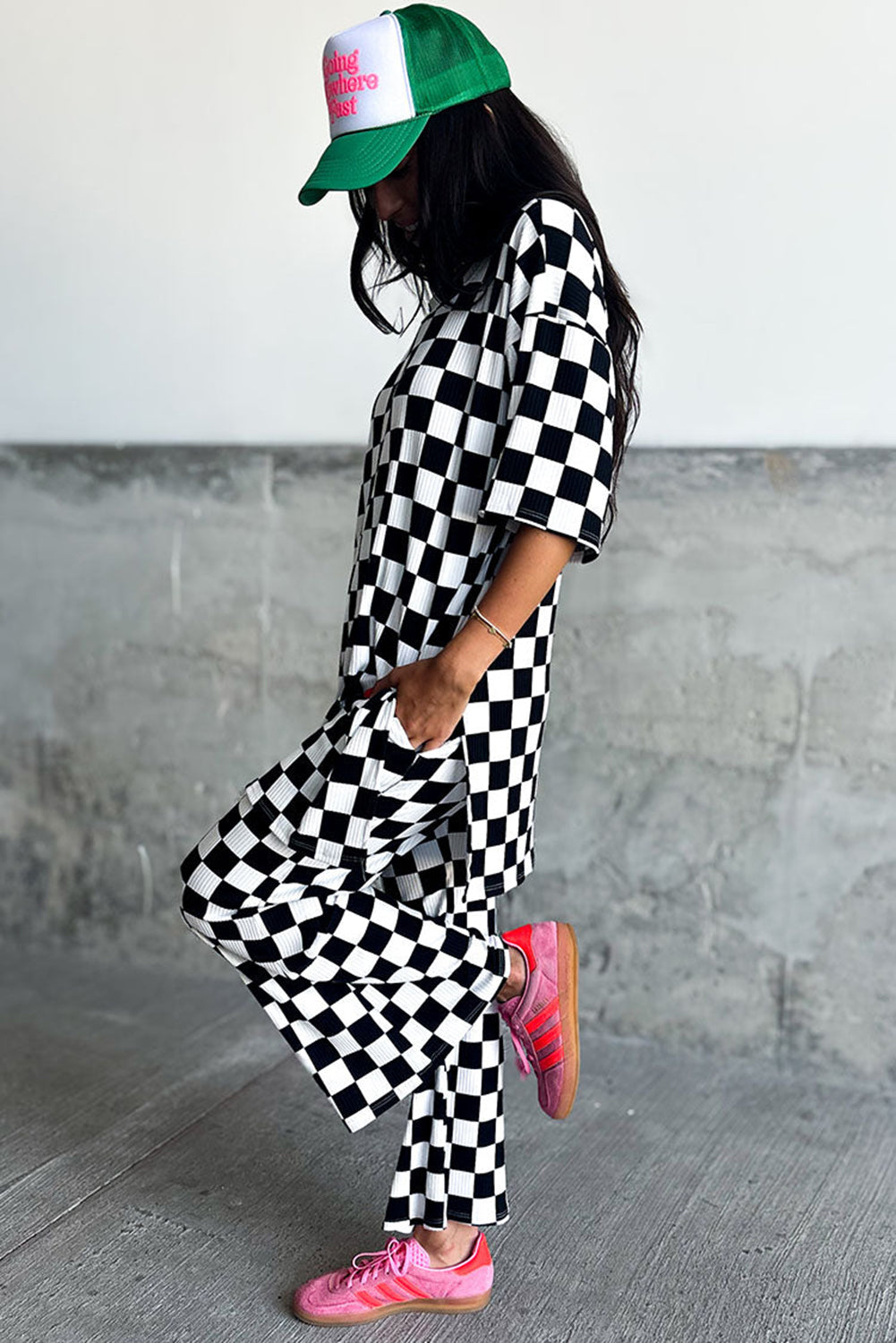 Chic black checkered tunic top and flared pant ensemble