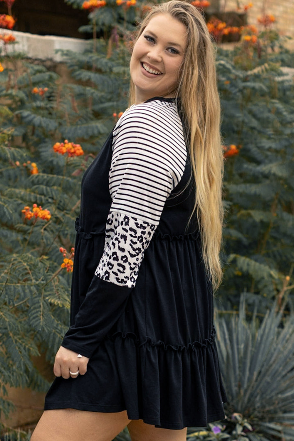 Chic black plus size ruffled dress with leopard and striped sleeves