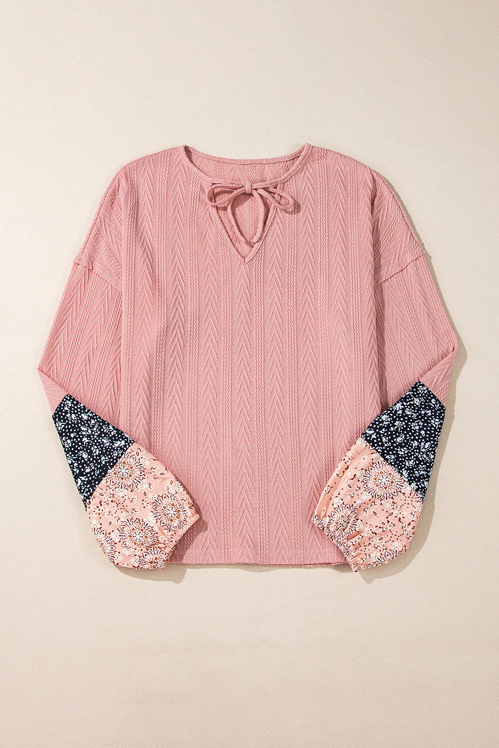 Dusty pink floral patchwork v-neck blouse with textured knit and drawstring detail