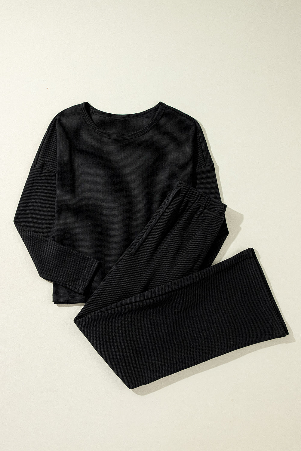 Cozy black textured lounge set with long sleeves and drawstring pants