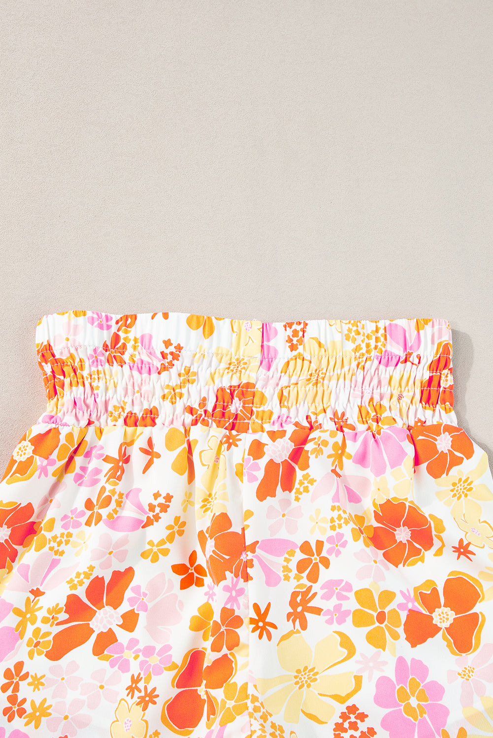 Chic orange floral high-waisted casual shorts with shirred detailing