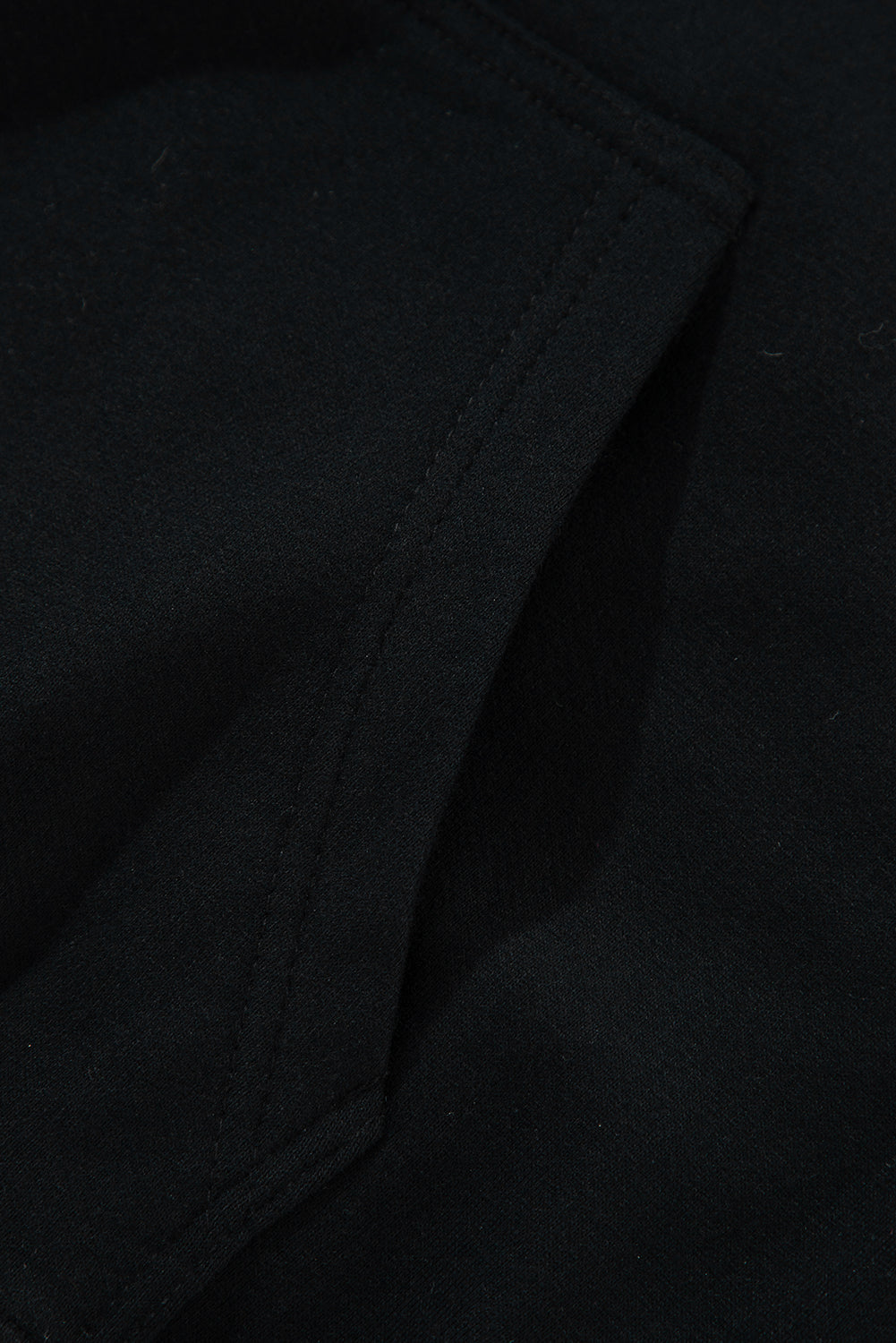 Cozy black fleece-lined hoodie with kangaroo pocket and drawstring design