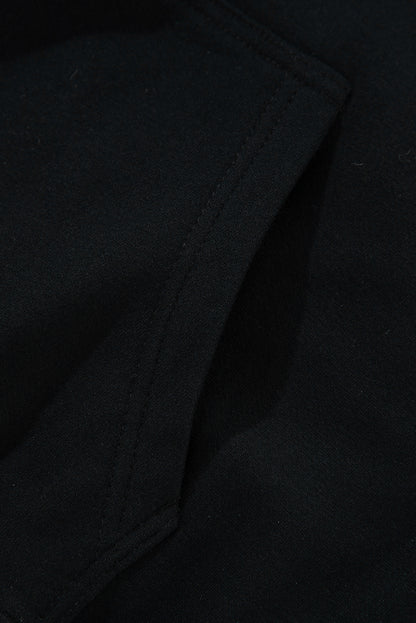 Cozy black fleece-lined hoodie with kangaroo pocket and drawstring design