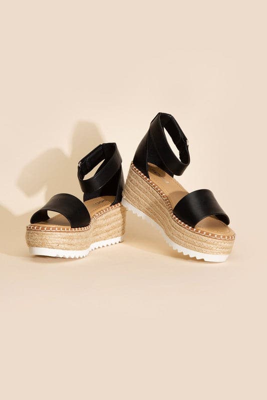 TUCKIN-S PLATFORM SANDALS.