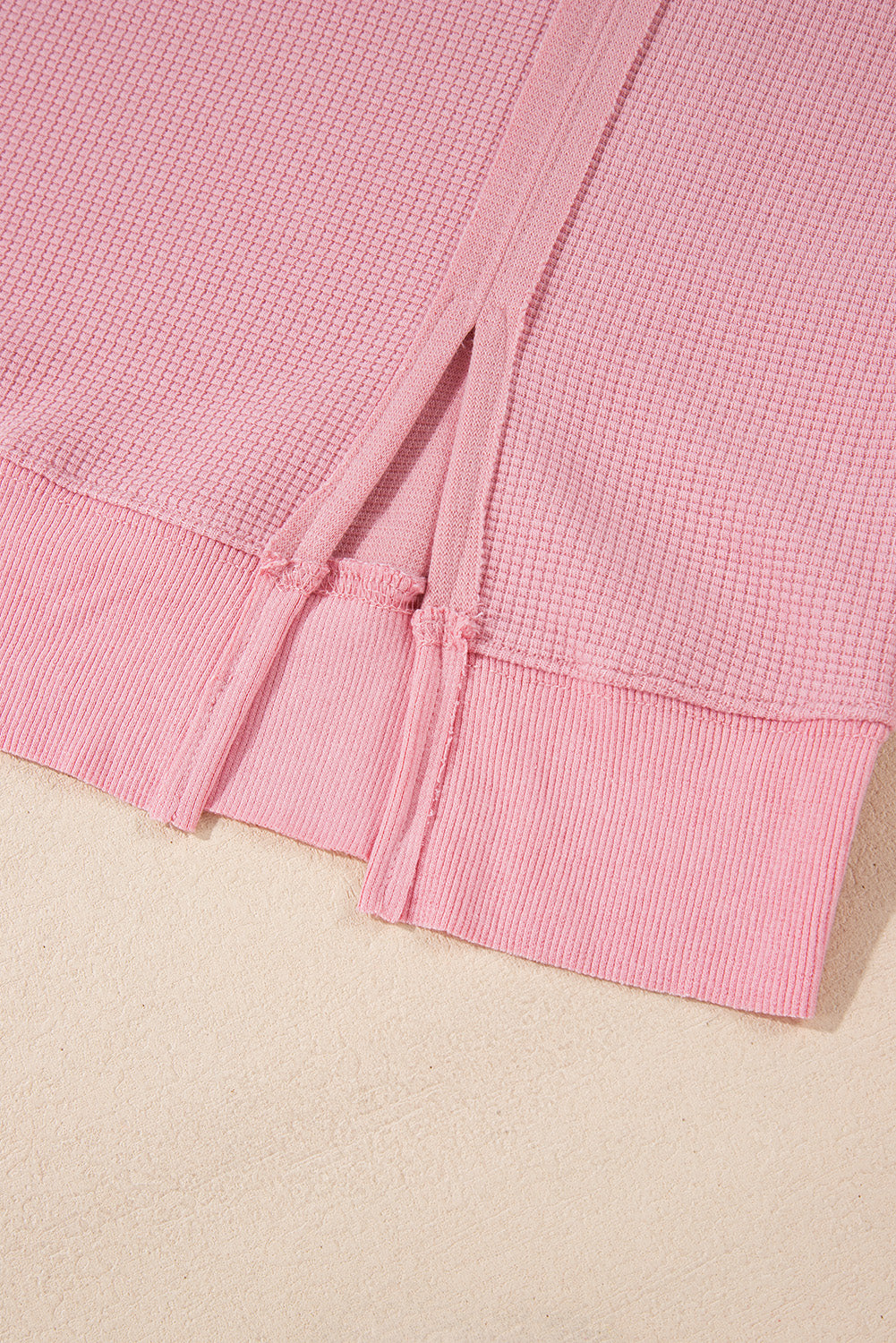 Cozy pink oversized sweatshirt with bishop sleeves and split detail