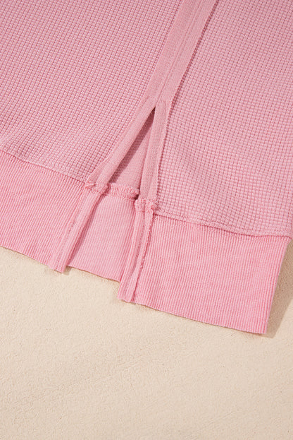 Cozy pink oversized sweatshirt with bishop sleeves and split detail