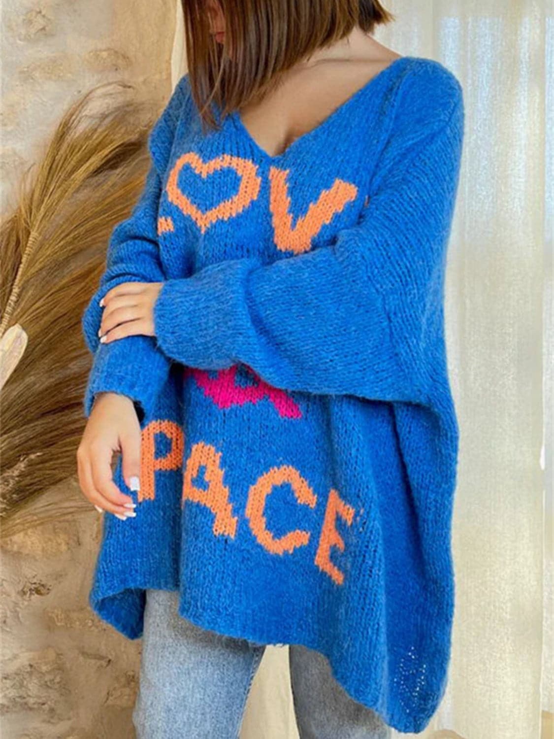 Peace Graphic V-Neck Long Sleeve Sweater.