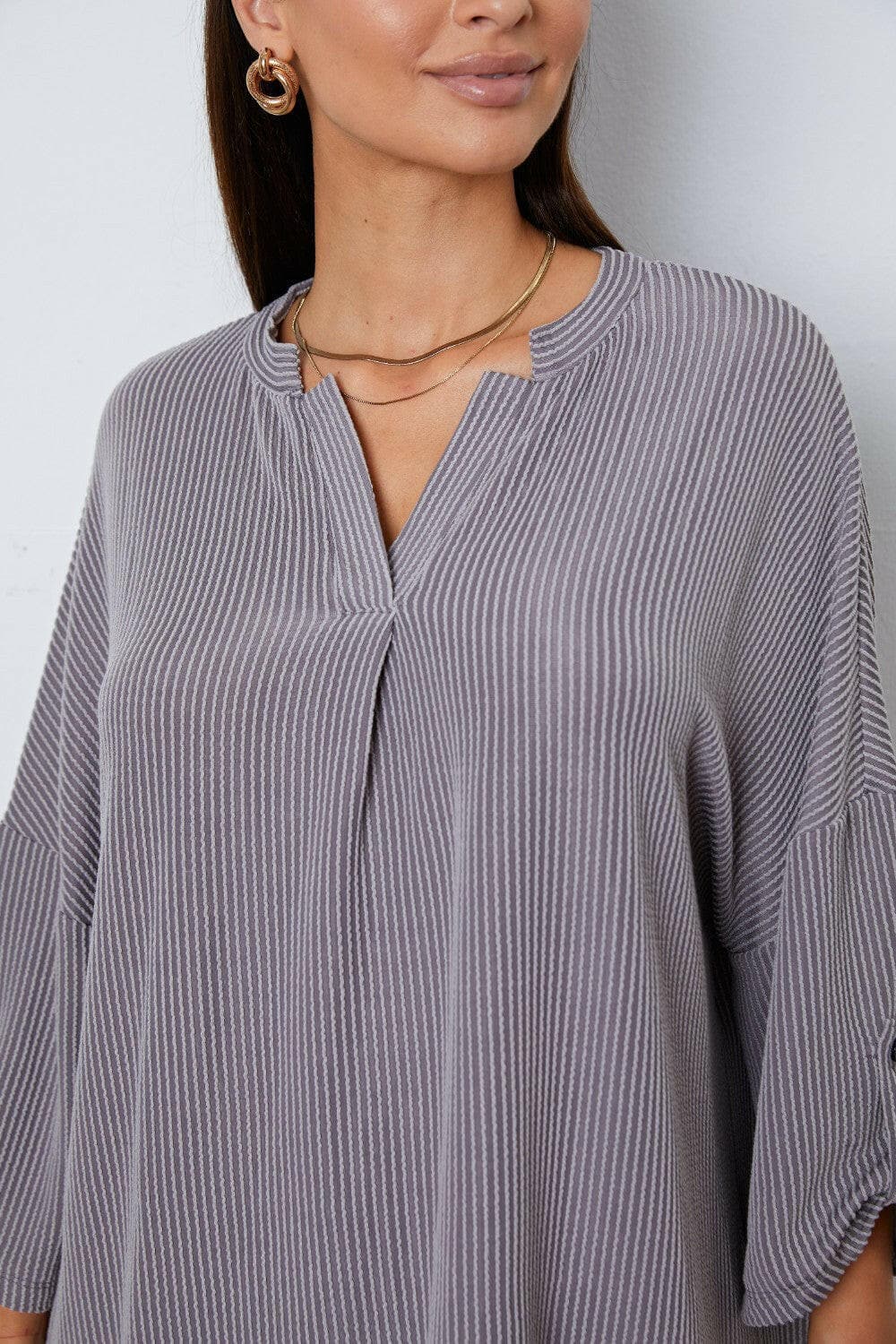 Notched Roll-Tab Sleeve Blouse.