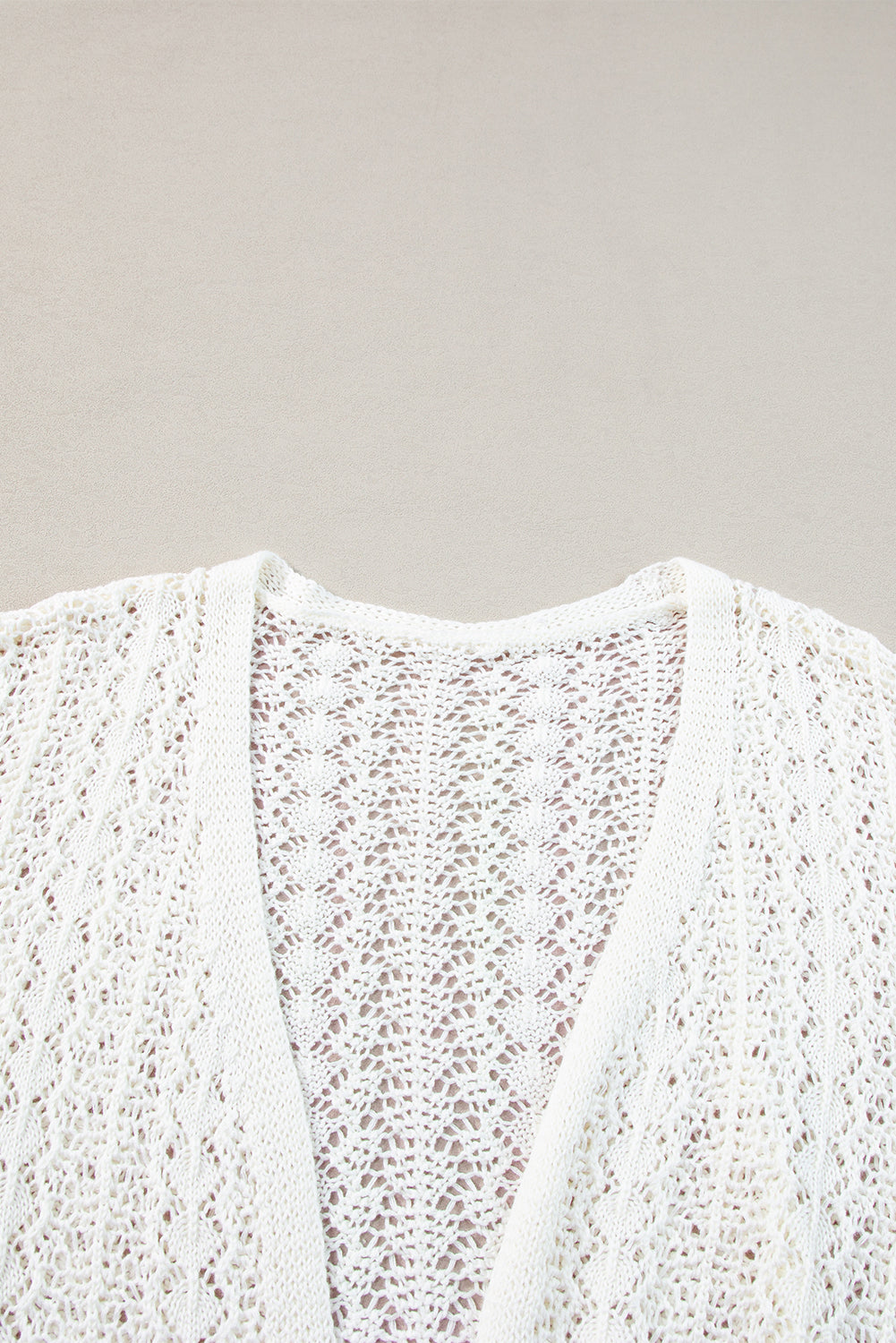 Chic white knit cardigan with hollow out details and drop shoulder design