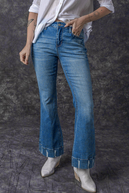 Chic light blue distressed flare jeans for a trendy look