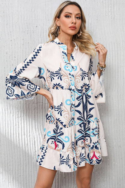 Tribal print mini dress with stylish bracelet sleeves and button detail