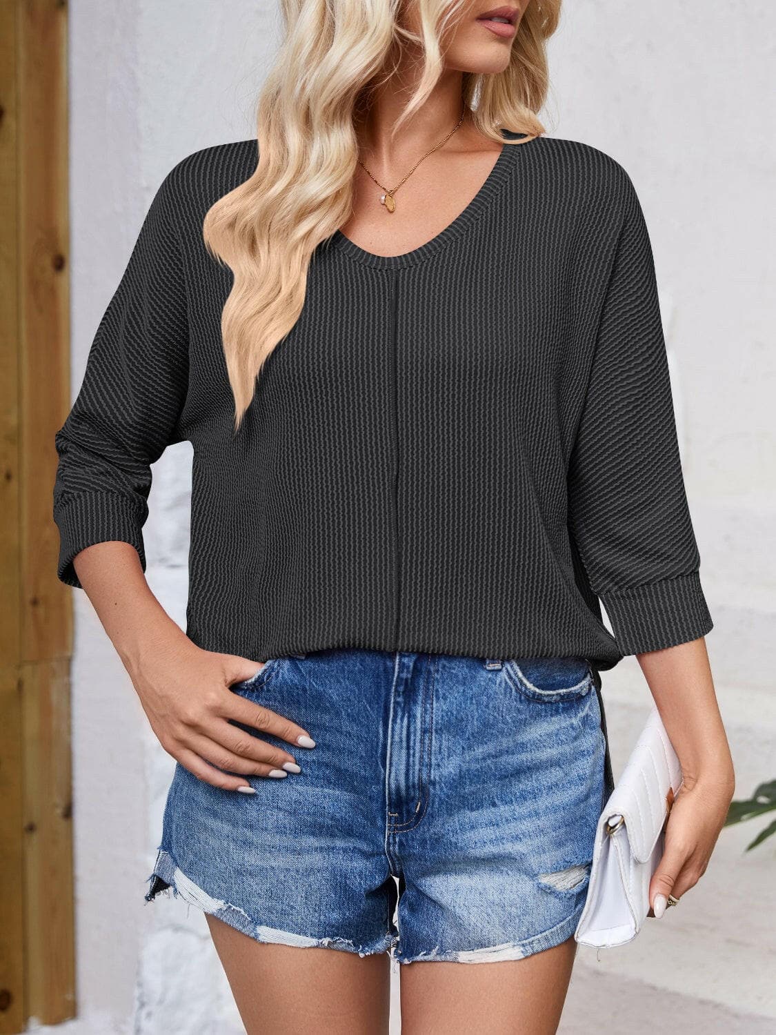 Textured Round Neck Three-Quarter Sleeve Blouse.