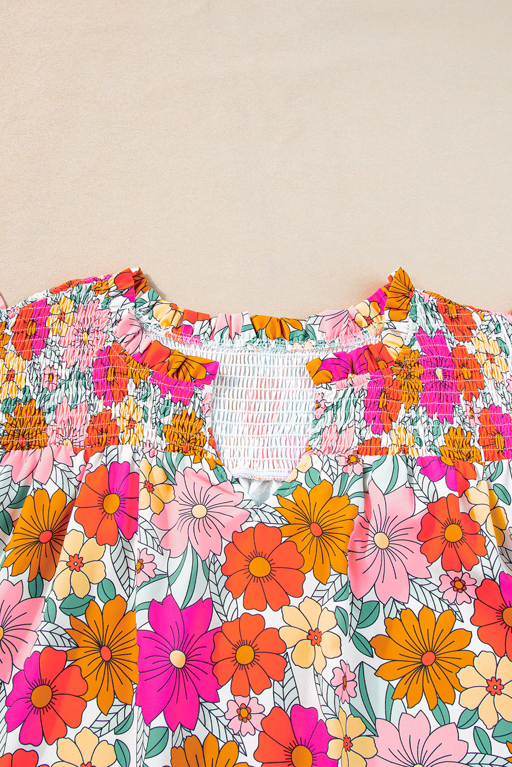 Vibrant floral plus-size ruffle sleeve blouse with notched neckline