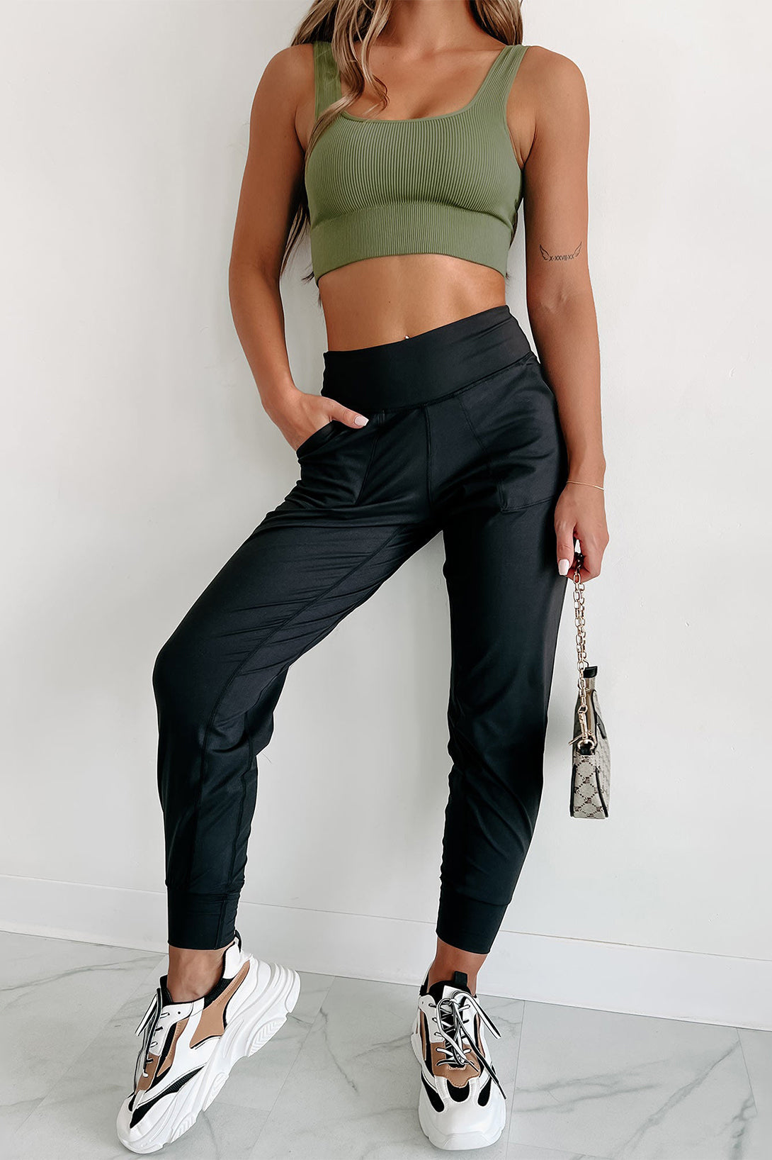 Modern high-waisted joggers with exposed seams and pockets