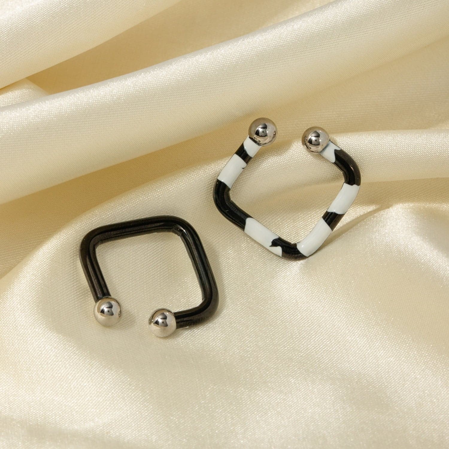 Stainless Steel Oil Drip Cuff Earrings.