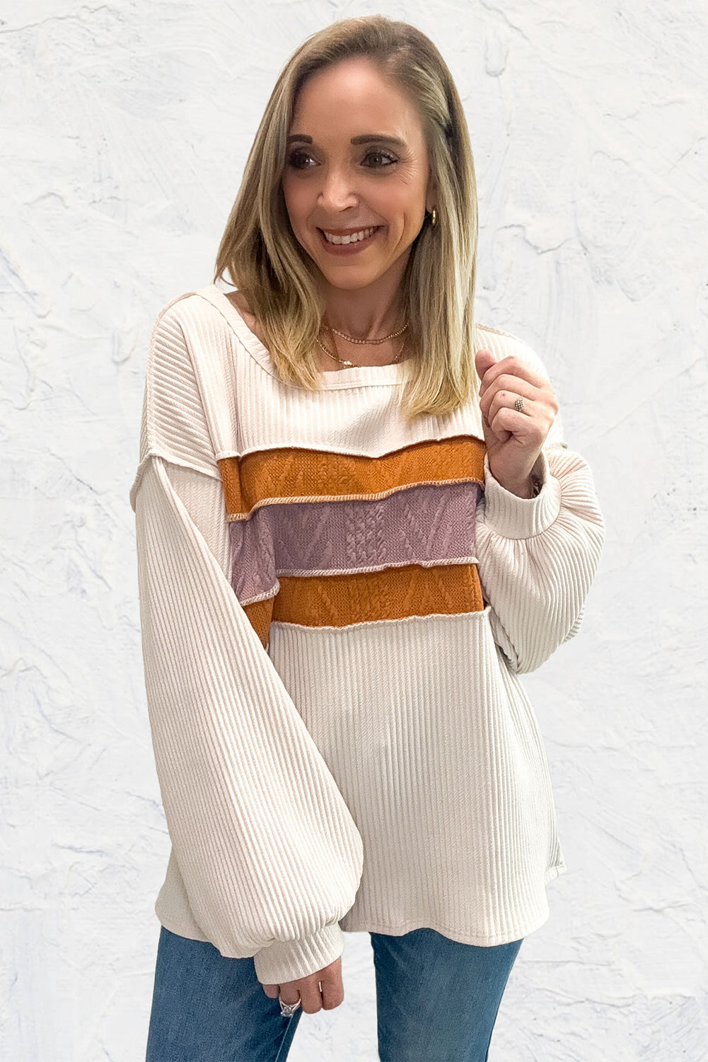 Chic white knit patchwork top with drop sleeves and exposed seams