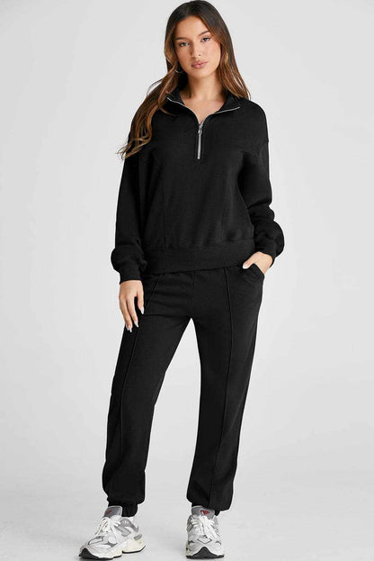 Half zip loungewear set with joggers in black, two-piece, polyester-cotton blend.