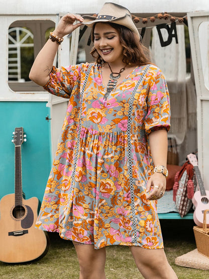 Plus Size Ruched Printed Half Sleeve Mini Dress.