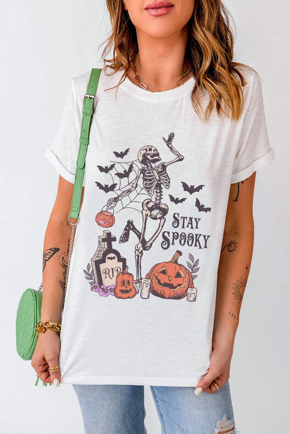 Stay spooky graphic tee featuring a skull pumpkin design for Halloween fun