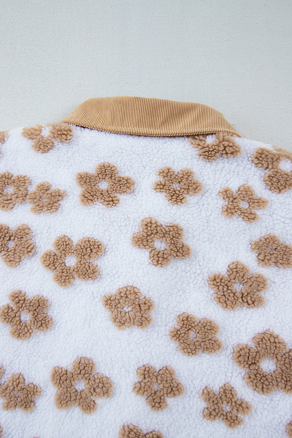 Charming beige fleece jacket with cute flower patterns and button-up design