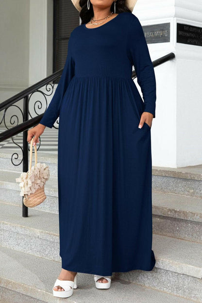 Plus Size Round Neck Long Sleeve Maxi Dress with PocketsPlus Size Round Neck Long Sleeve Maxi Dress with Pockets
 Indulge in effortless style and comfort with our Plus Size Round Neck Long Sleeve Maxi Dress featuring convLove Salve Size Round Neck Long Sleeve Maxi Dressplus