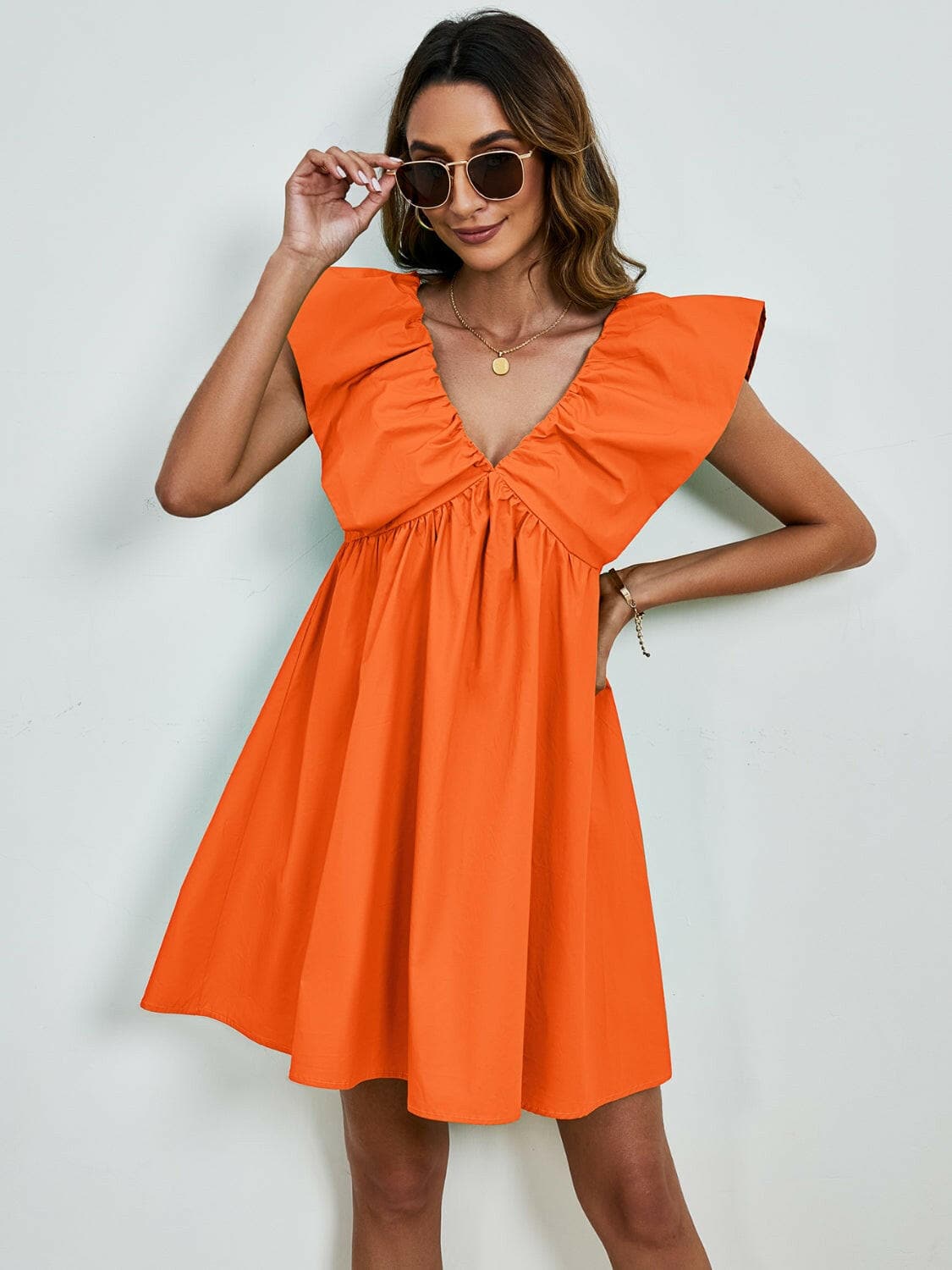 V-Neck Cap Sleeve Mini DressUpgrade Your Style with Our V-Neck Cap Sleeve Mini Dress
 Step out in confidence and elegance with our V-Neck Cap Sleeve Mini Dress, a versatile piece that effortlesLove Salve -Neck Cap Sleeve Mini Dress