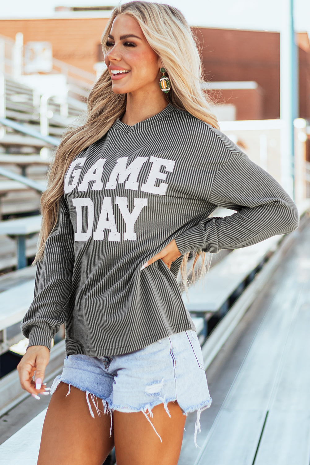 Game day ready: Dark grey corded graphic long sleeve crewneck top