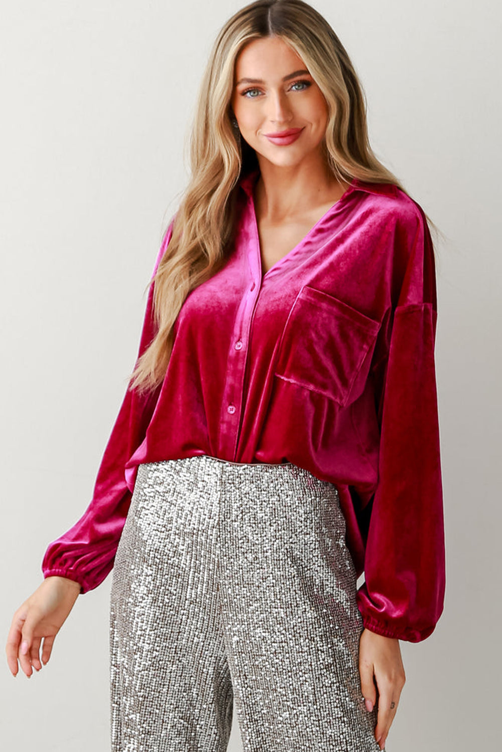 Chic pitaya pink velvet shirt with button details and V-neckline