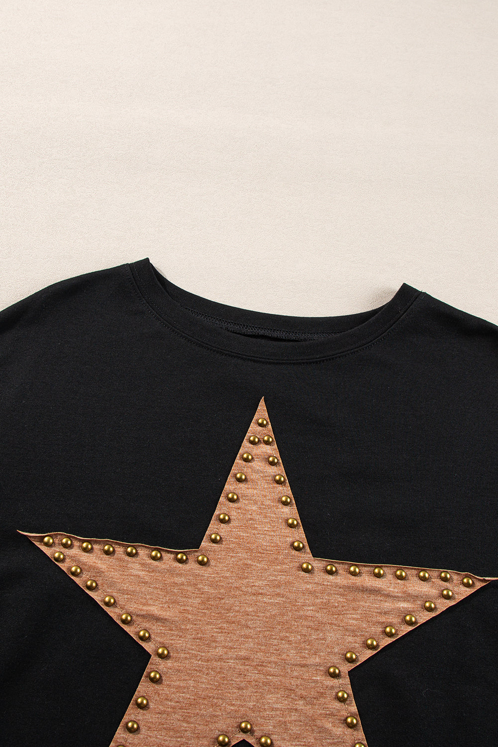 Black oversized studded star top