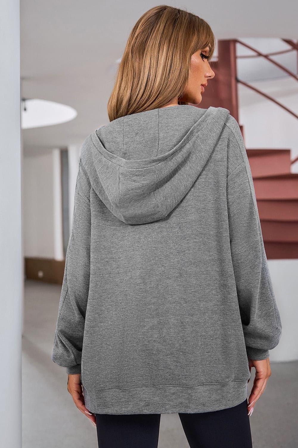 Pocketed Zip Up Dropped Shoulder Hooded Jacket.